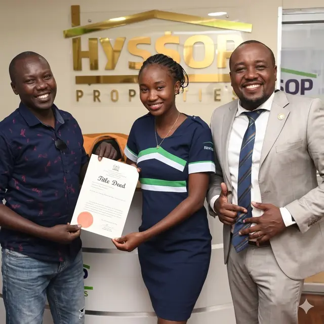 Hyssop client receiving their title deed